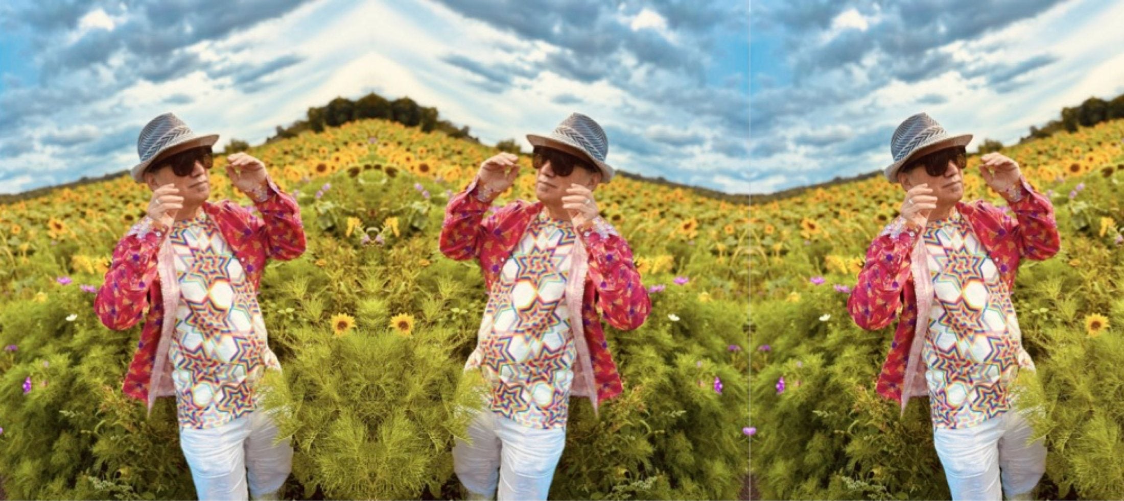 Michael Susko in a sunflower field wearing a Made With Maths tessellation print
